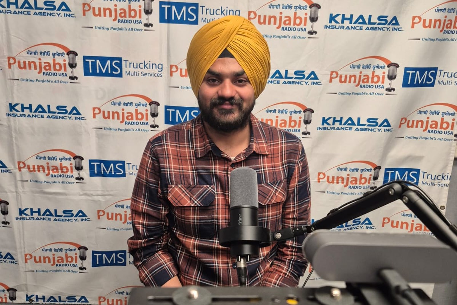 Sunnyrudh Singh in an agricultural media or interview setting